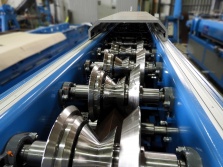 Rake trim roll forming machine