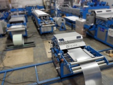 Sheet metal straightening-feeding machine