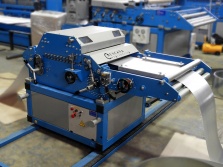 Sheet metal straightening-feeding machine