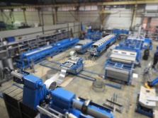 Sheet metal straightening-feeding machine